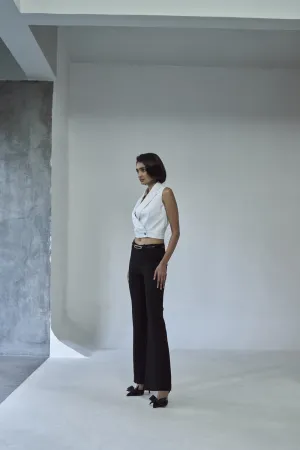 Cropped tuxedo jacket with flared pants.