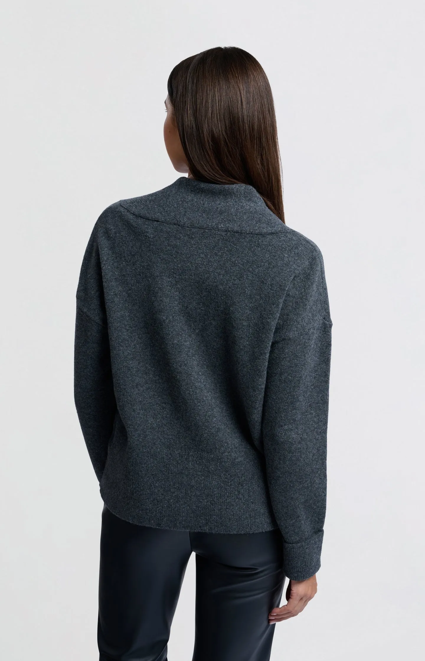 Soft sweater with deep V-neck and subtle rib details
