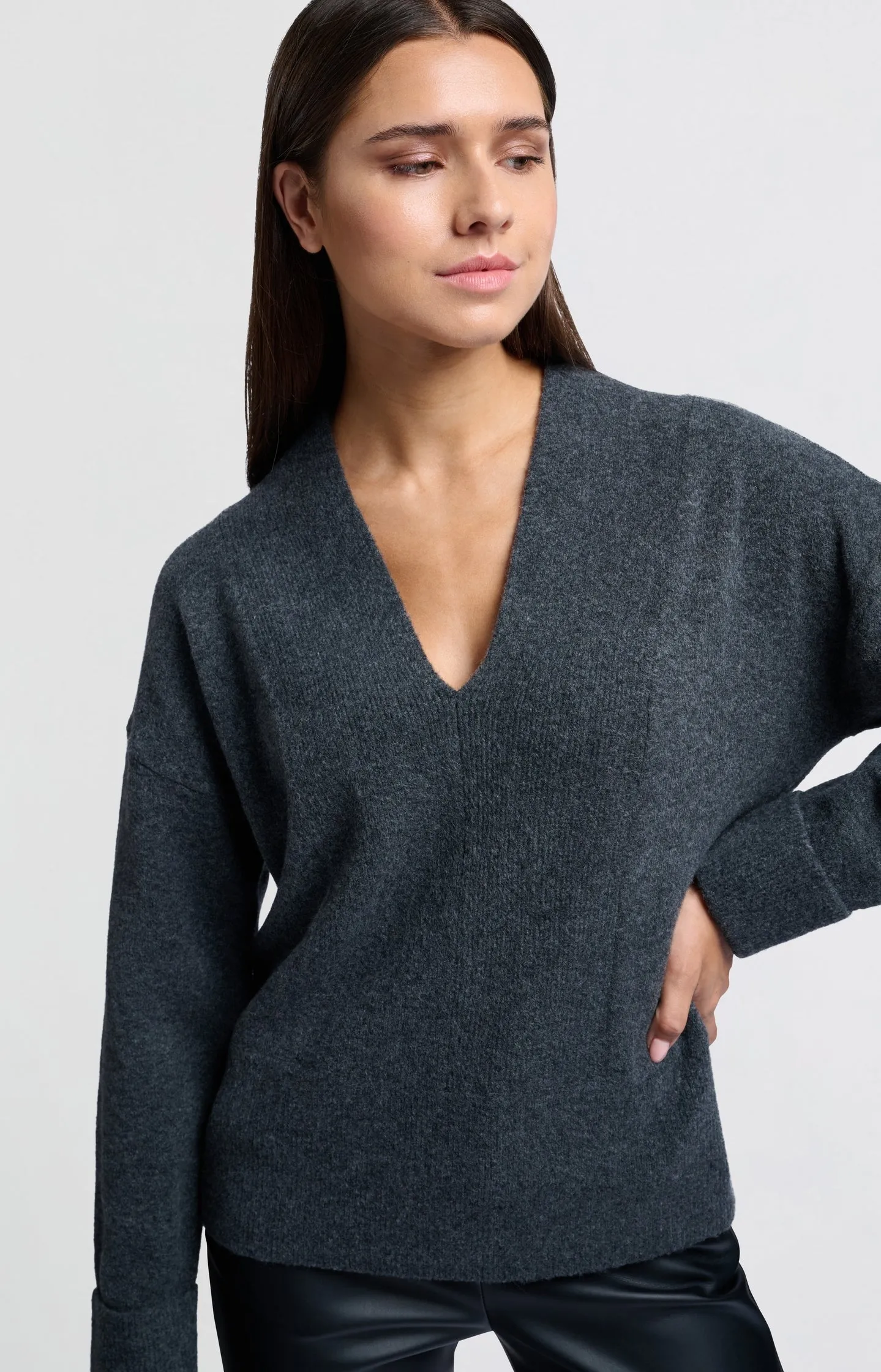 Soft sweater with deep V-neck and subtle rib details